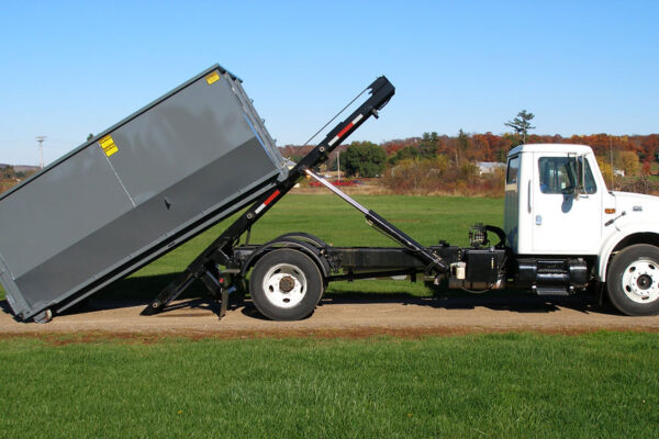 Roll off truck hoist