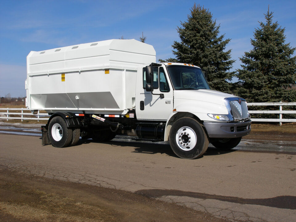 Rolloff truck with custom chipper box