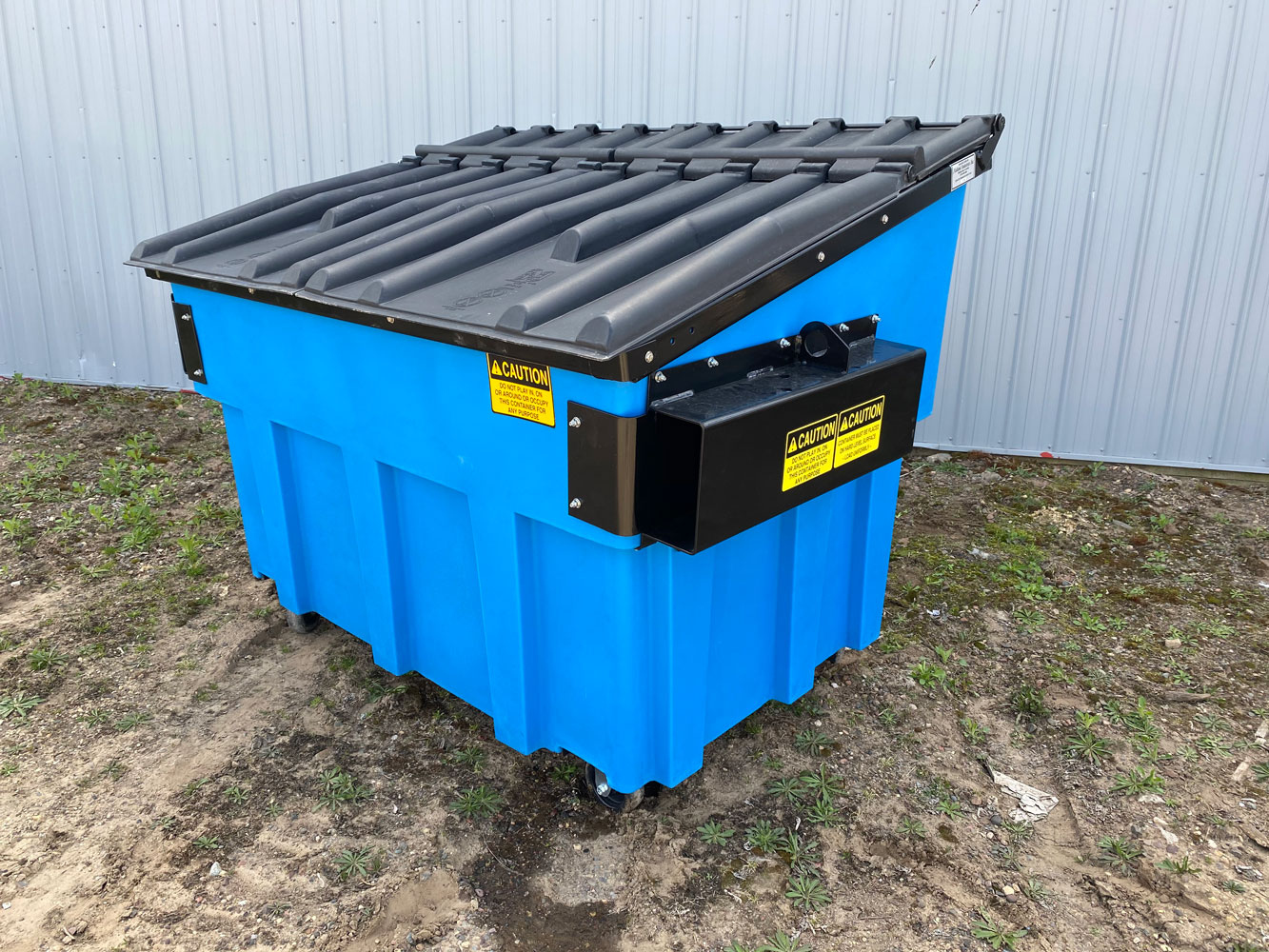 blue front-load plastic dumpster