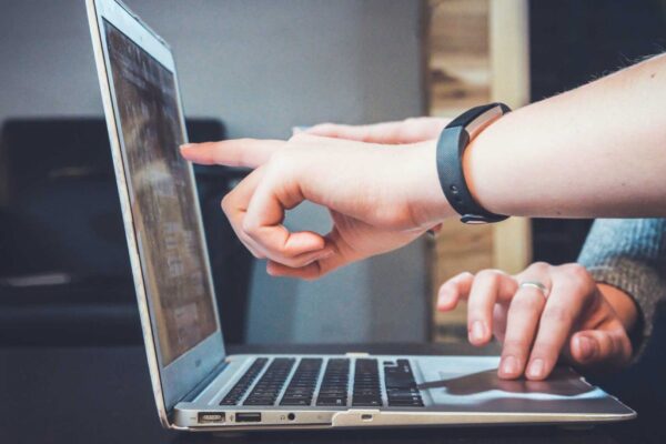 marketer pointing at computer screen
