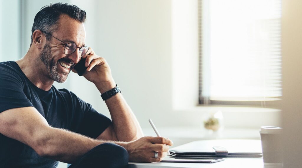Man talking to a customer on the phone