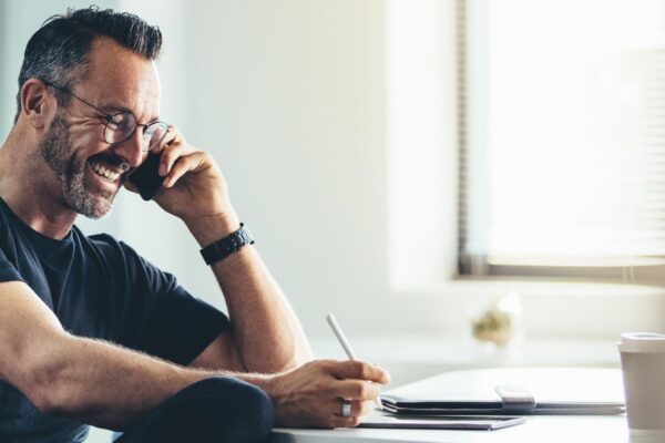 Man talking to a customer on the phone