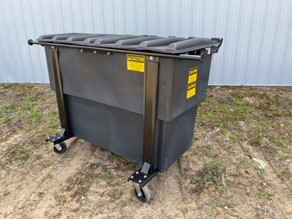 A gray Nedland plastic rear load dumpster