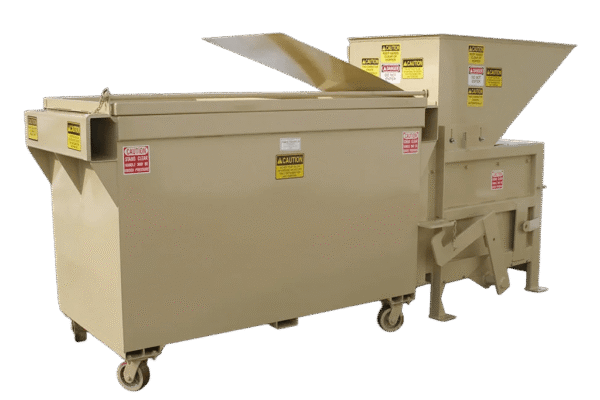 A tan Nedland 0.6 yard apartment stationary compactor