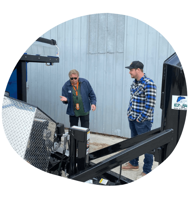 Dave Nedland showing a new customer how to operate his EZrolloff system