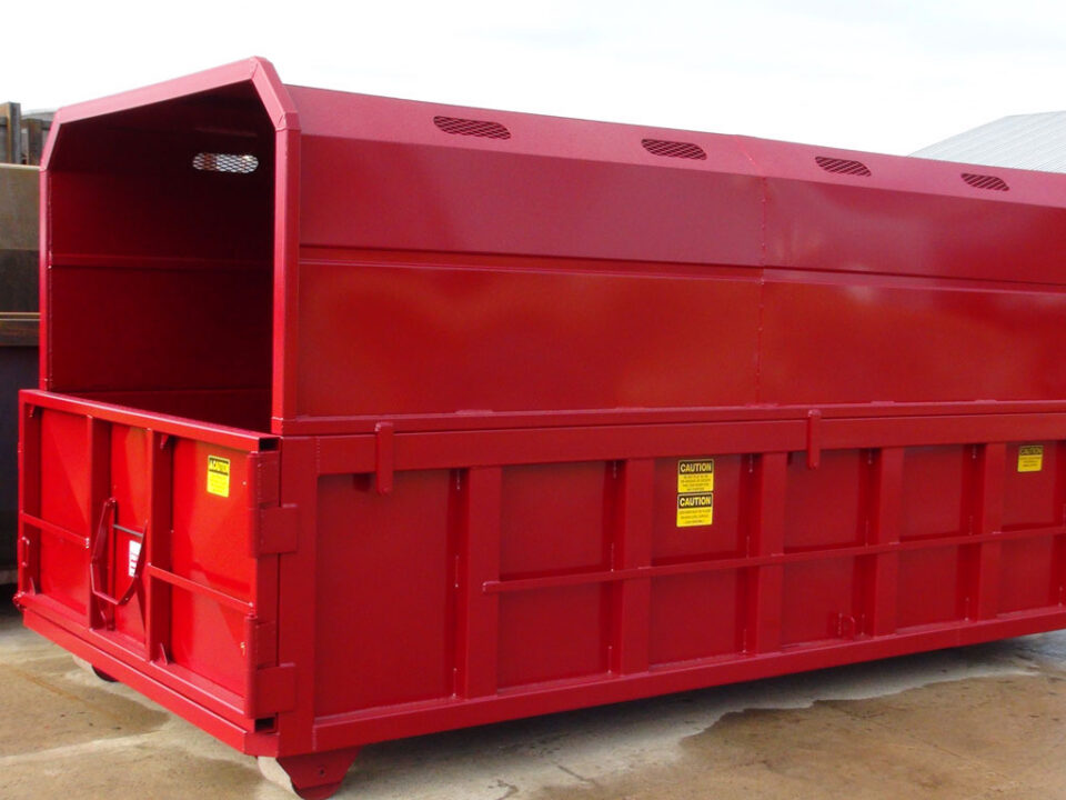 A red roll off chipper box