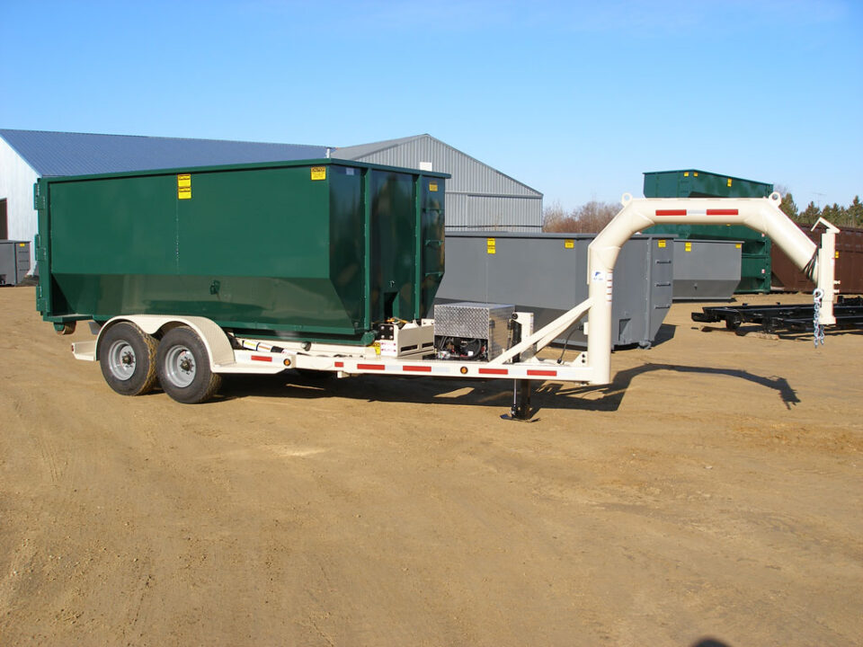 A white 16,000 GVWR roll off trailer with gooseneck hitch and a green dumpster